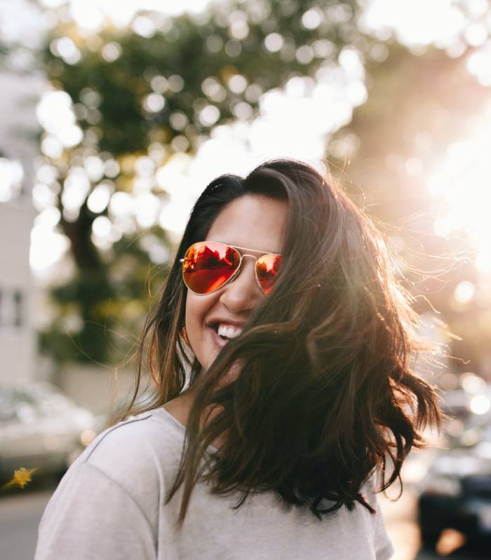 Smiling woman in sunglasses